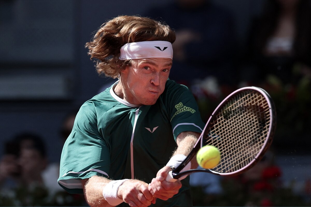 Russia's Andrey Rublev returns the ball against US' Taylor Fritz during the 2024 ATP Tour Madrid Open tournament semifinal tennis match at Caja Magica in Madrid on May 3, 2024. (Photo by Thomas COEX / AFP)