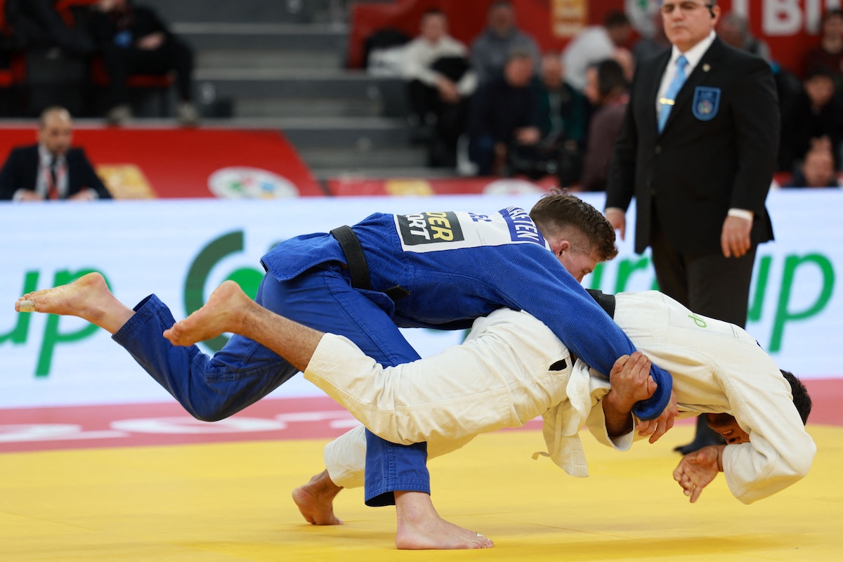 Uzbekistan's Samariddin Kuchkarov (white) competes against Belgium's Jorre Verstraeten in the men's under 60 kg bronze medal bout at the Tbilisi Grand Slam judo tournament in Tbilisi on March 20, 2026. (Photo by Giorgi ARJEVANIDZE / AFP)