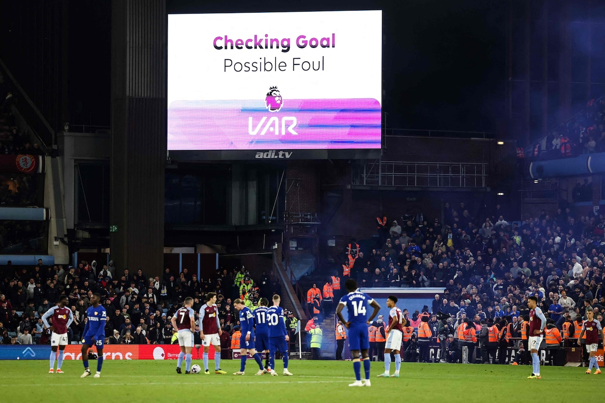 Players wait for referee Craig Pawson to check the VAR before disallowing the goal of Chelsea's French defender #02 Axel Disasi due to an offside position during the English Premier League football match between Aston Villa and Chelsea at Villa Park in Birmingham, central England on April 27, 2024. (Photo by Darren Staples / AFP) / RESTRICTED TO EDITORIAL USE. No use with unauthorized audio, video, data, fixture lists, club/league logos or 'live' services. Online in-match use limited to 120 images. An additional 40 images may be used in extra time. No video emulation. Social media in-match use limited to 120 images. An additional 40 images may be used in extra time. No use in betting publications, games or single club/league/player publications. /