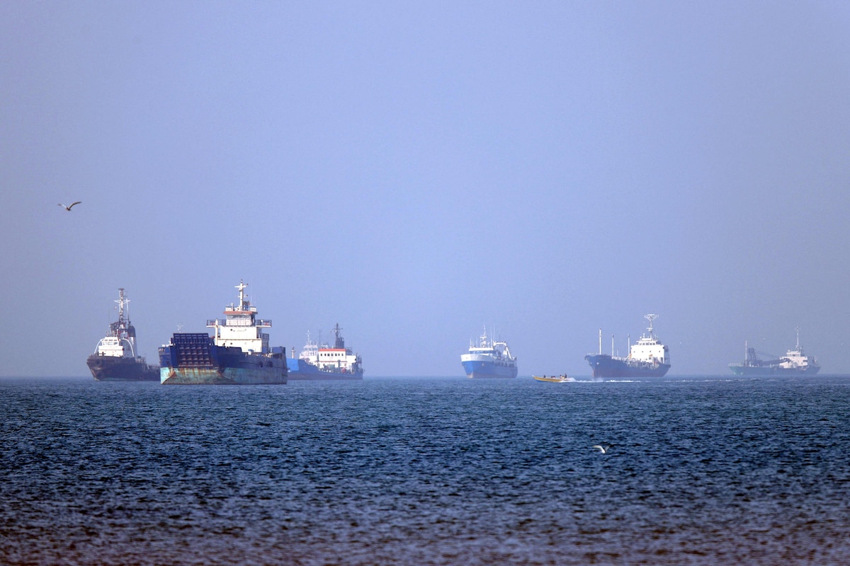In this picture obtained from Iran's ISNA news agency on May 4, 2026, vessels are pictured anchored in the Strait of Hormuz off Bandar Abbas in southern Iran. Iran's Revolutionary Guards on May 4 denied that any commercial ships had crossed the Strait of Hormuz, after the US military earlier said two US-flagged merchant vessels had transited through the vital waterway. (Photo by Amirhossein KHORGOOEI / ISNA / AFP) /