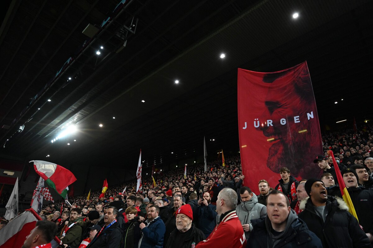 Liverpool fans wave giant flags ahead of the UEFA Champions League last 16 first leg football match between Liverpool and Real Madrid at Anfield in Liverpool, north west England on February 21, 2023. (Photo by Paul ELLIS / AFP)