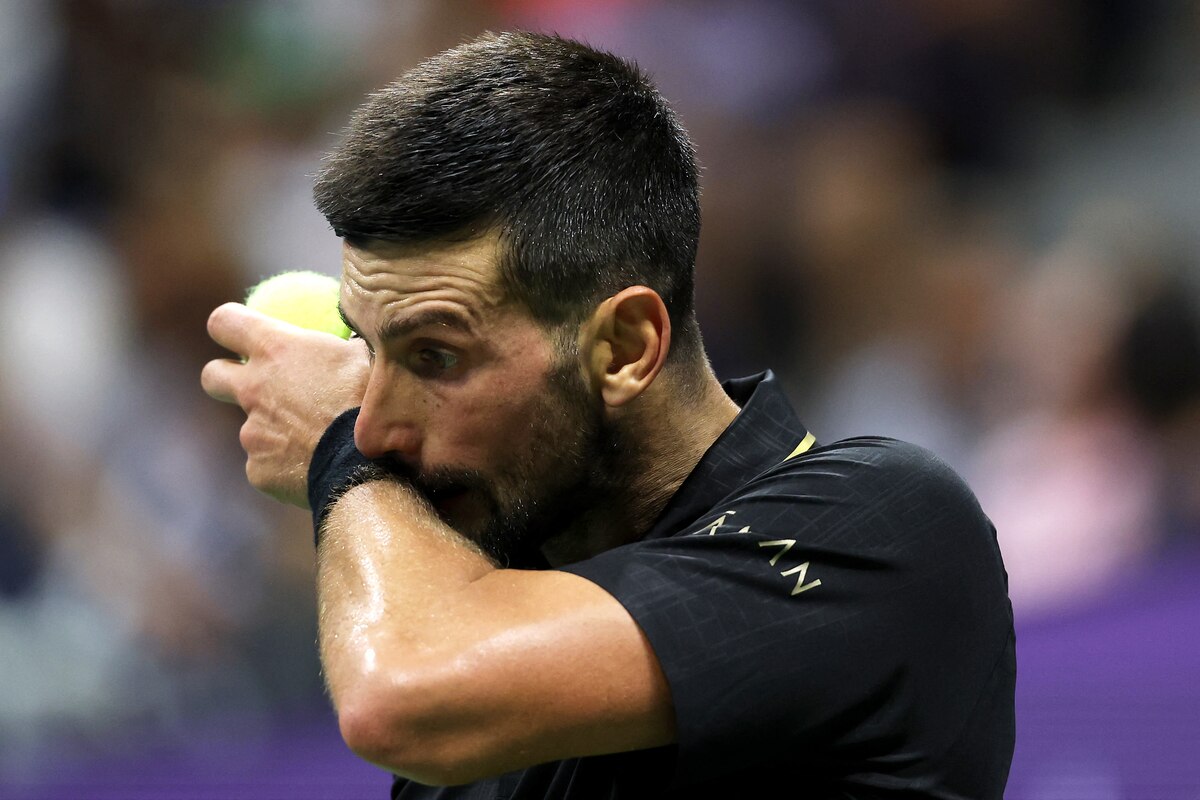 NEW YORK, NEW YORK - AUGUST 24: Novak Djokovic of Serbia reacts against Learner Tien of the United States during their Men's Singles First Round match on Day One of the 2025 US Open at USTA Billie Jean King National Tennis Center on August 24, 2025 in the Flushing neighborhood of the Queens borough of New York City. Clive Brunskill/Getty Images/AFP (Photo by CLIVE BRUNSKILL / GETTY IMAGES NORTH AMERICA / Getty Images via AFP)