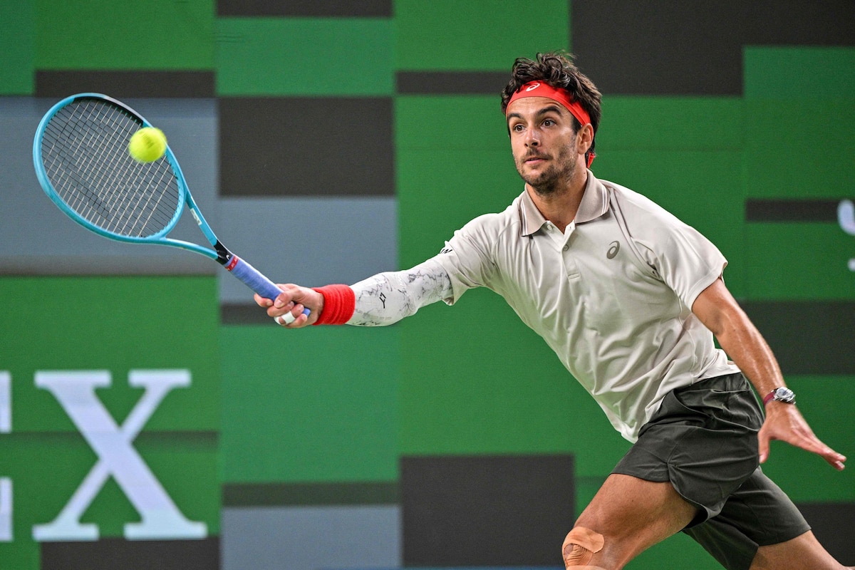 Italy's Lorenzo Musetti hits a return to China's Yi Zhou during their men's singles match at the Shanghai Masters tennis tournament in Shanghai on October 9, 2026. (Photo by Hector RETAMAL / AFP)