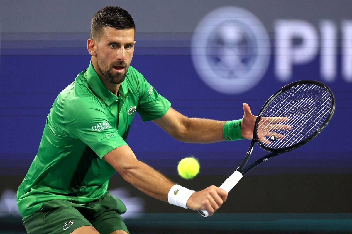 MIAMI GARDENS, FLORIDA - MARCH 25: Novak Djokovic of Serbia comes to the net for a shot to Lorenzo Musetti of Italy during the Miami Open Presented by Itau at Hard Rock Stadium on March 25, 2025 in Miami Gardens, Florida. Matthew Stockman/Getty Images/AFP (Photo by MATTHEW STOCKMAN / GETTY IMAGES NORTH AMERICA / Getty Images via AFP)